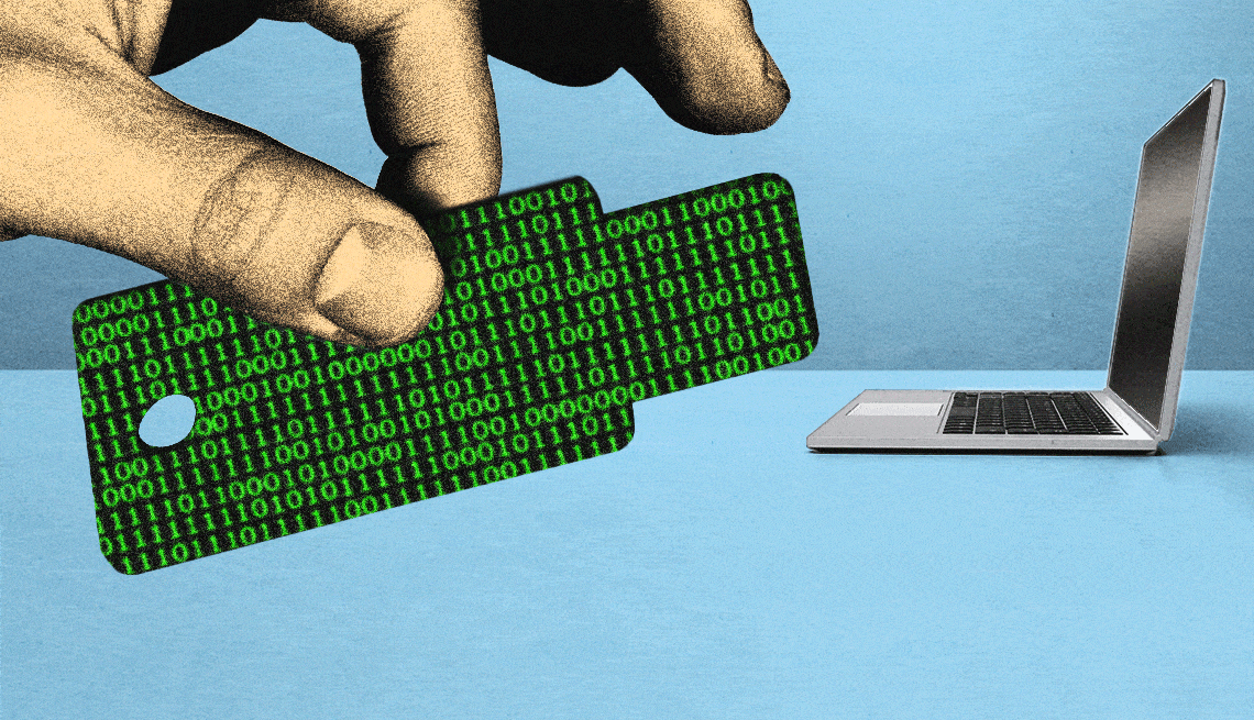 hand holding a computer passkey with animated zeros and ones on it the laptop is in the background